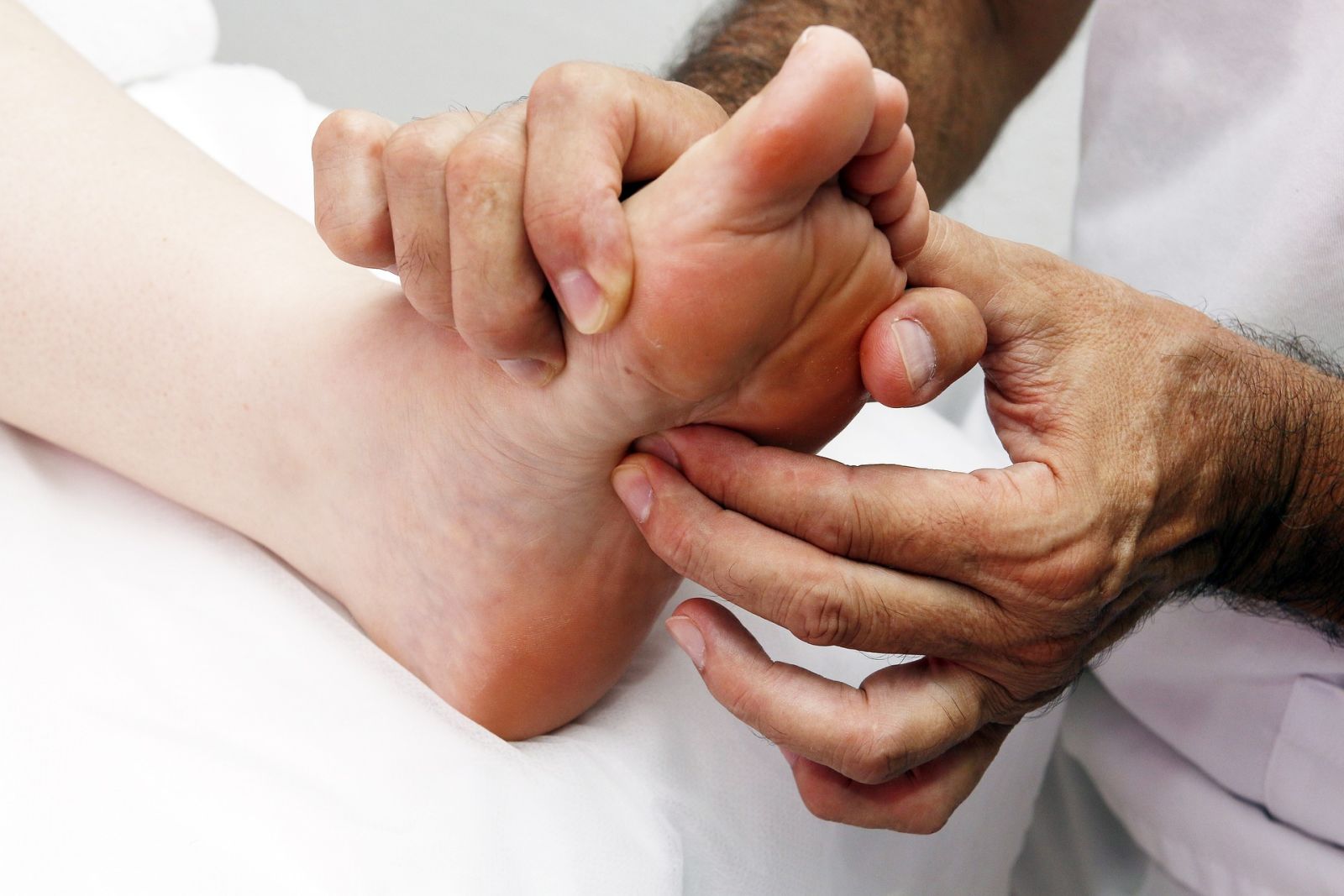 a therapist providing a foot massage