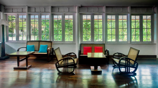 The Tower House - Kochin Caned Art Deco arm chairs built as a loungers