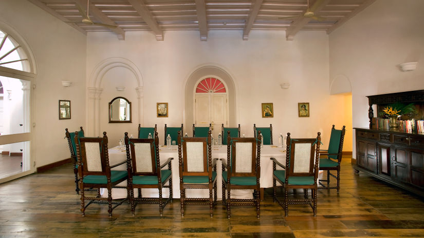 The Tower House - Conference room with blue chairs and wooden furniture