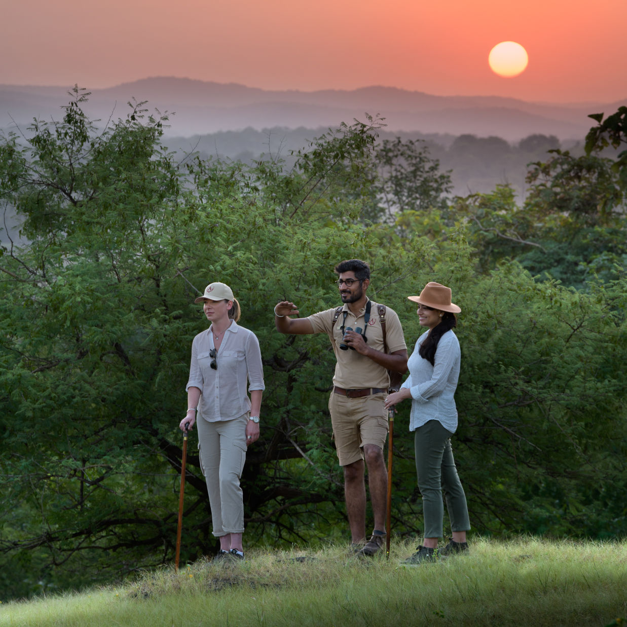 Guests Hiking Amidst the Sunset