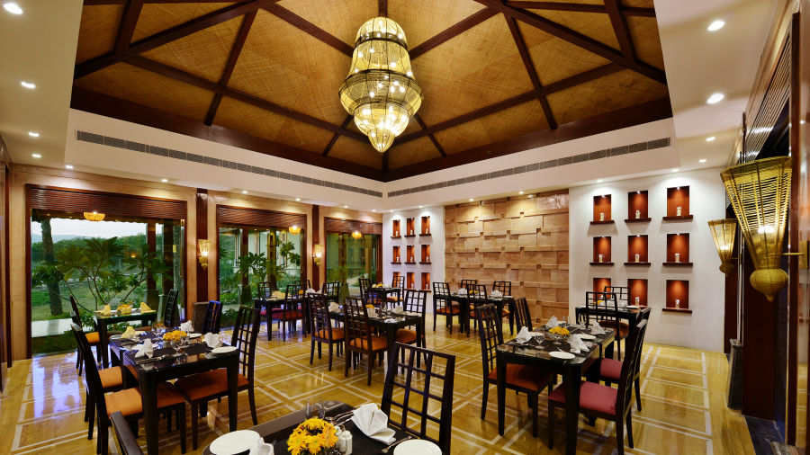 Seating arrangement inside Oasis restaurant - The Ananta Udaipur