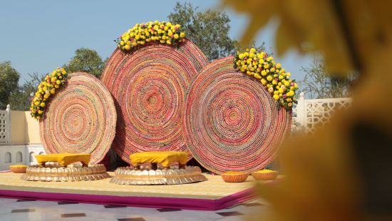 a stage set up on the terrace for the bride and groom with good decorations - heritage village resorts & spa, Manesar