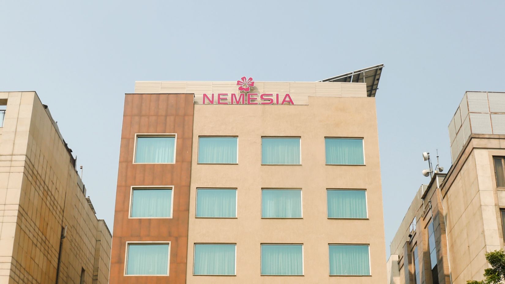 Facade of Nemesia Hotel in Guegaon 1