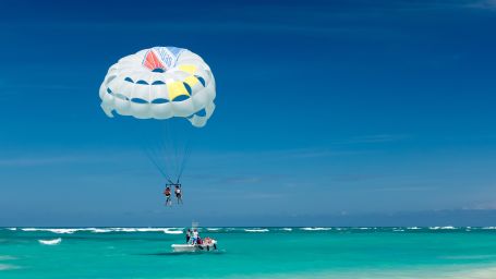 person enjoying parasailing in Goa