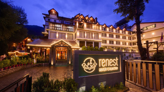 Renest Hotel Manali - View of the property facade illuminated with lights at night time