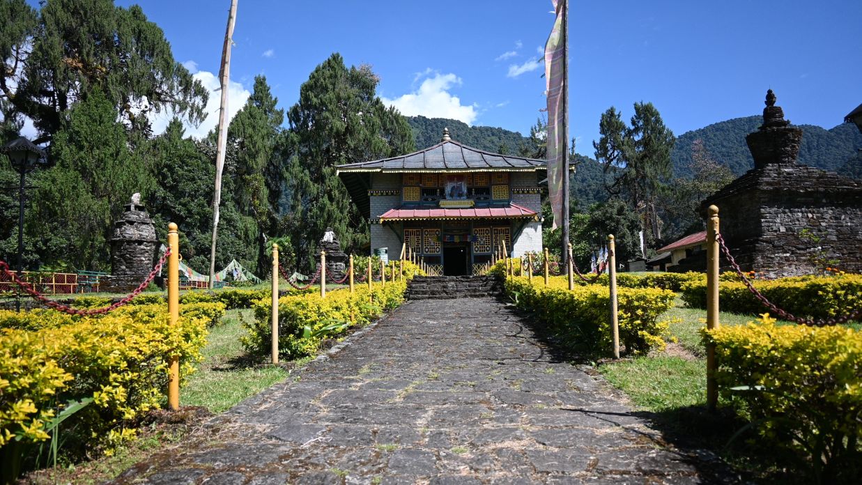 blue sky green trees and temple like structure @ Lamrin Norwood Green, Palampur