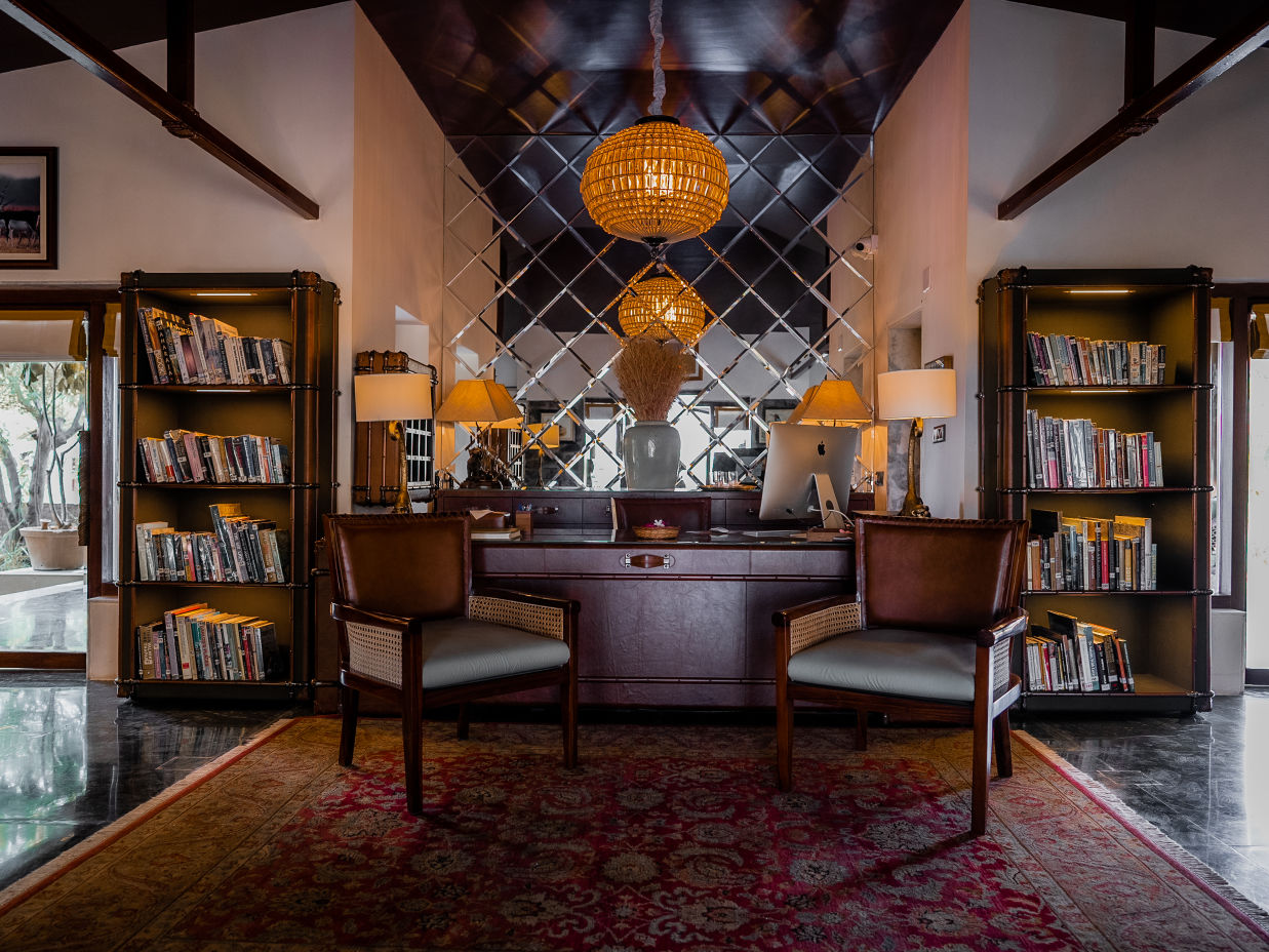 The Blackbuck Lodge - a picture showing the reception of our lodge with two shelves full of books