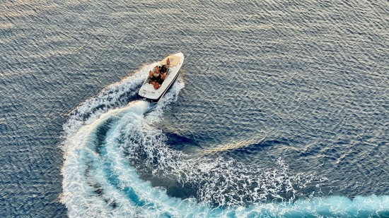 overhead view of people in a speedboat