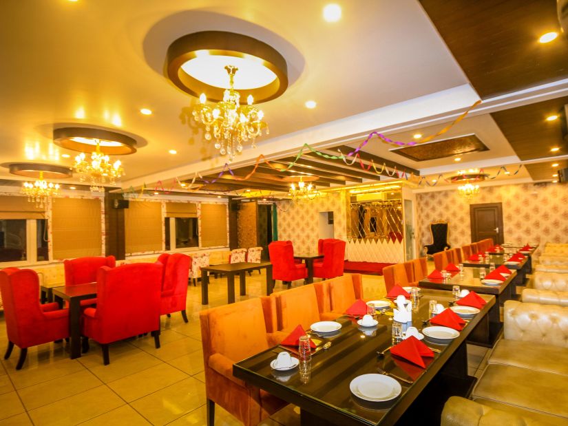 a warmly-lit interior of our restaurant at Little Mastiff, Dharamshala