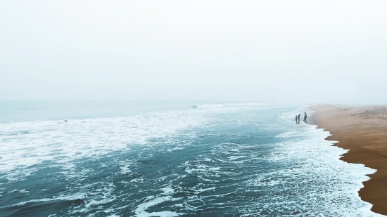 an overview of a Beach in Chennai with waves overlapping the sand