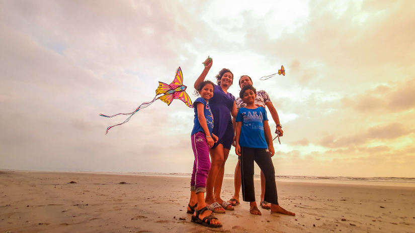 Lotus Eco beach resort, guests with kites on a beach