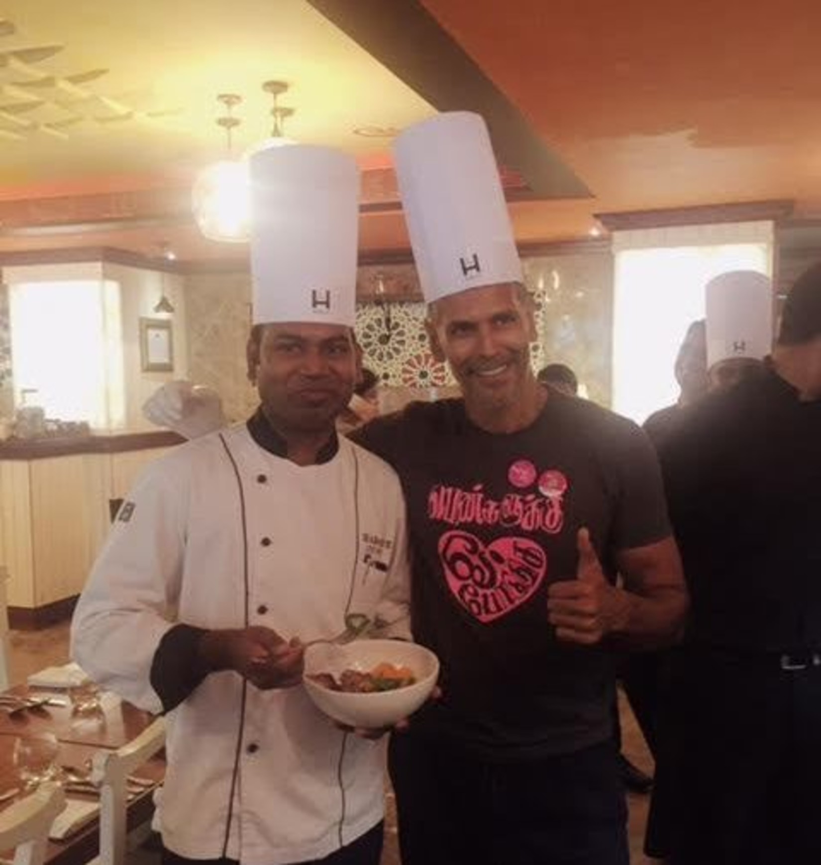 Chef Sathya and Milind Soman posing for a picture at Hablis Hotel, Chennai