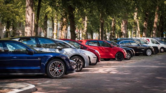 a image of cars parked by the road