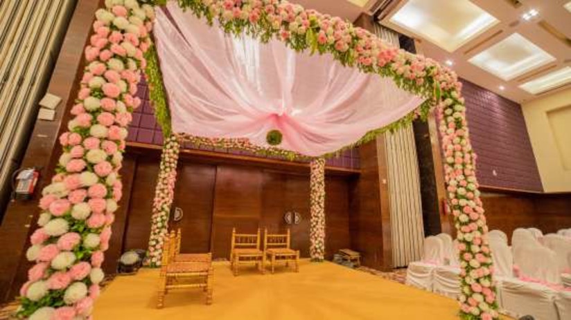 Hotel wedding venues with large banquet hall and flower decoration