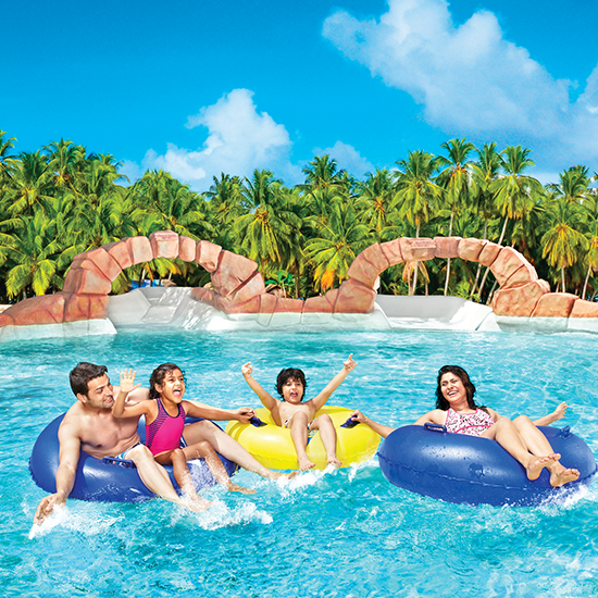 Water Kingdom - a family of 4 in a pool at Amazonia