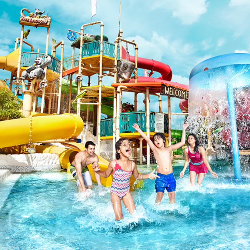 Water Kingdom - a family playing in a pool at our water park