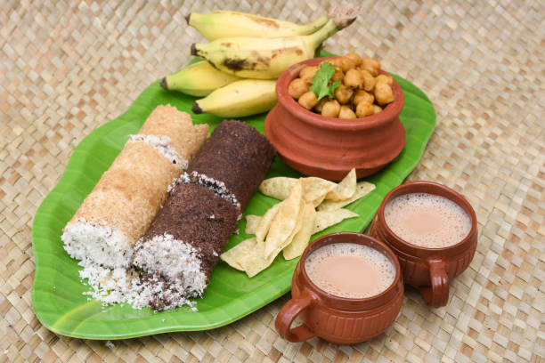 Puttu served with banana and two cups of hot tea