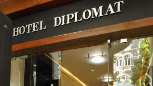 Entrance of Hotel Diplomat with glass door