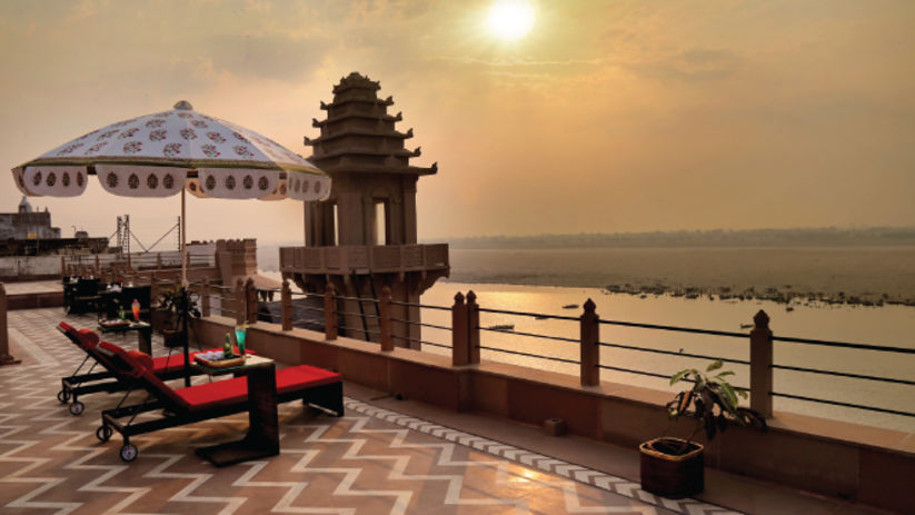 Brij Hotels - an image of a sunset from a rooftop of the palace