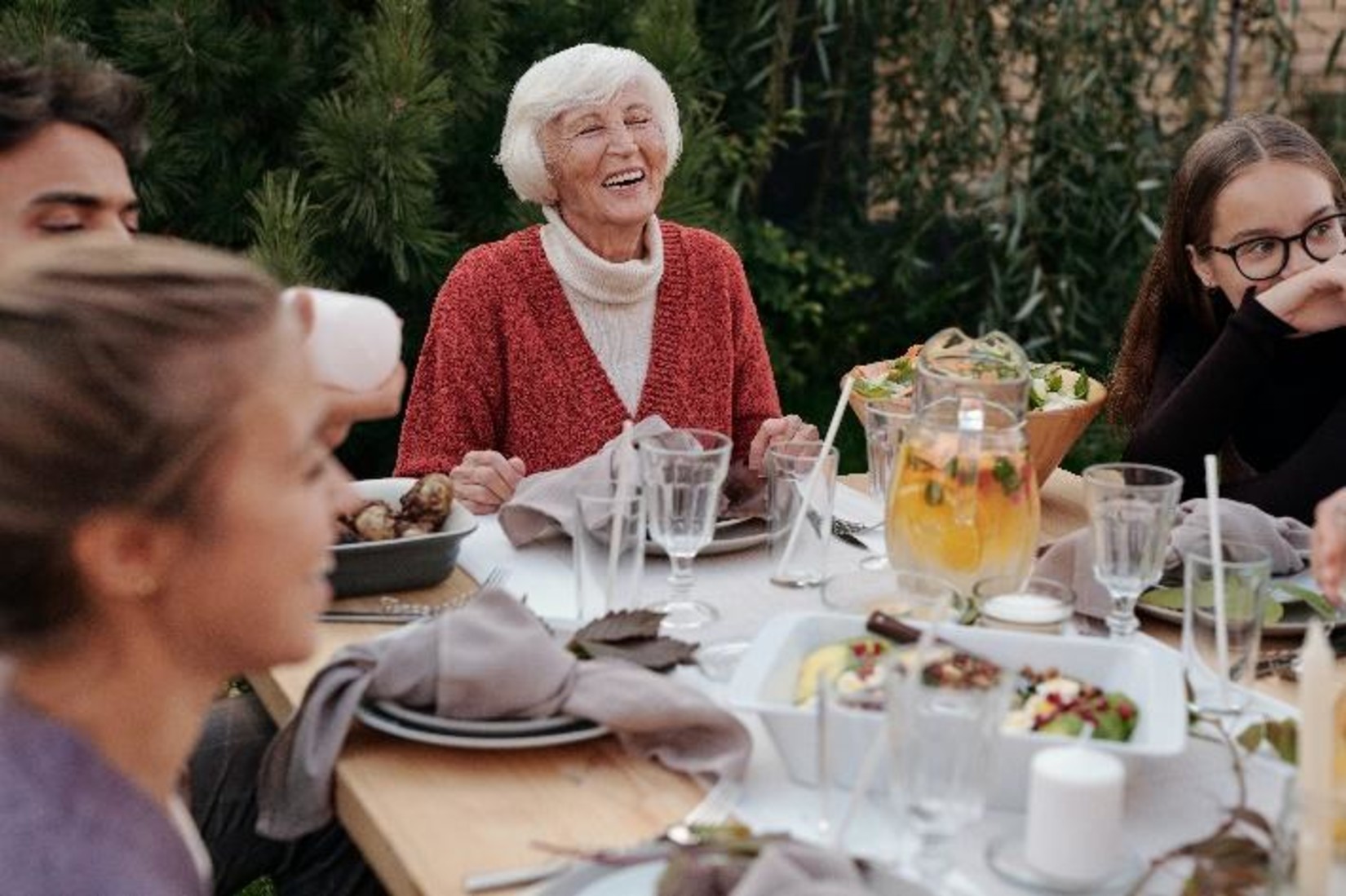 family sitting around a table and dining