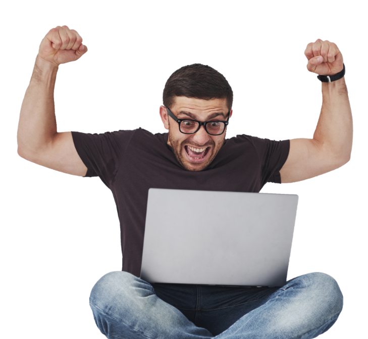 A young man ecstatic after confirming his reservation on his laptop.