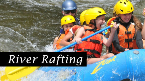 A group of friends river rafting in Manali