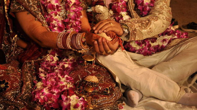 a couple following wedding rituals