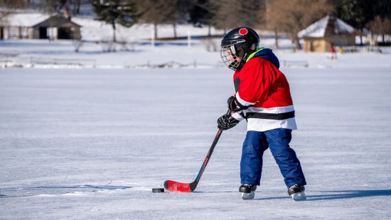 A child playing ice hockey