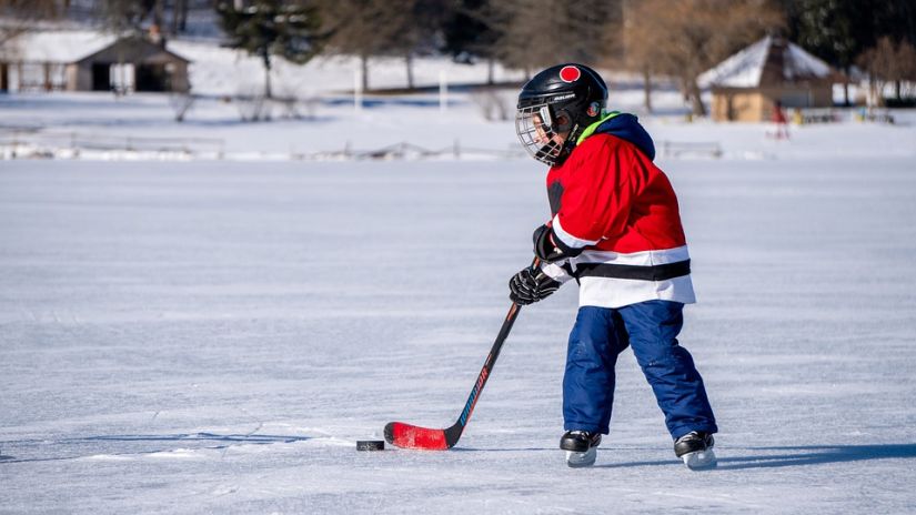 A child playing ice hockey 