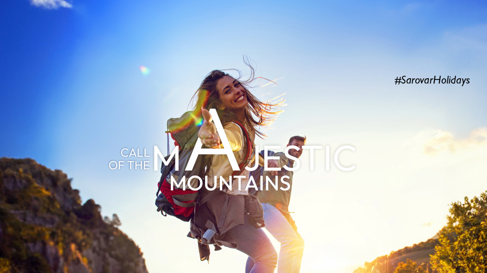 A smiling woman in hiking attire, extending her hand, with the phrase CALL OF THE MAJESTIC MOUNTAINS #SarovarHolidays above.