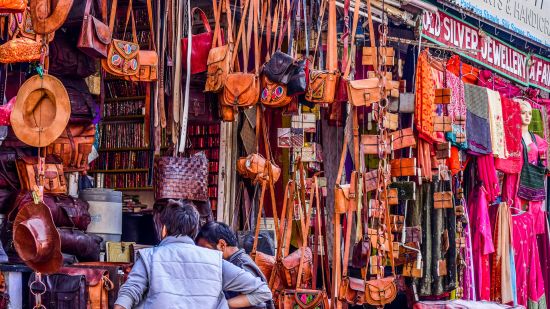 bags hanging at a market