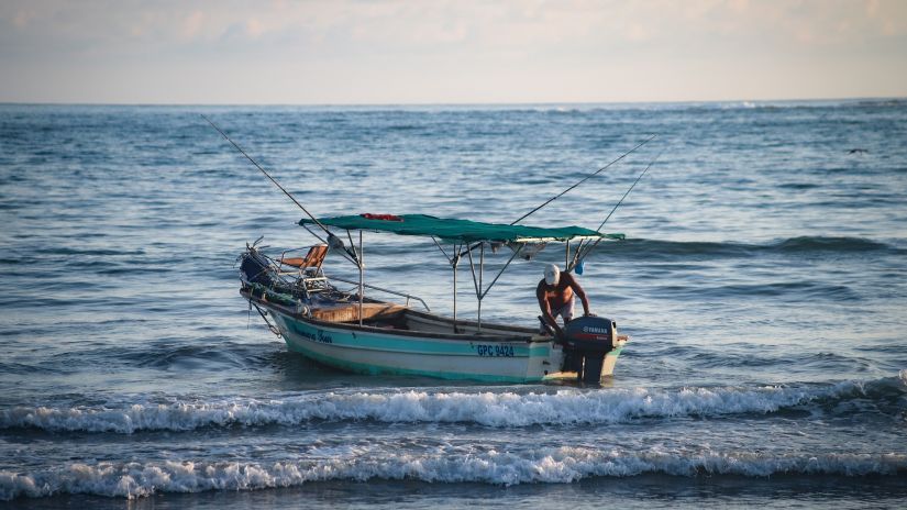 A man fishing on a boat