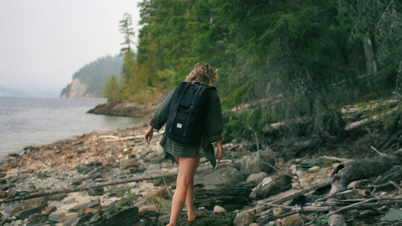 A woman walking on the seashore