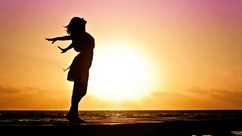 silhouette of woman at beach