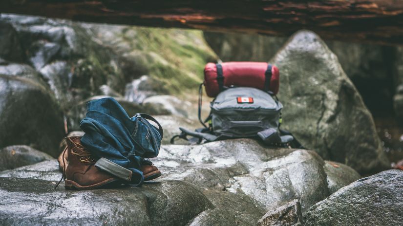 backpacks kept on rocks