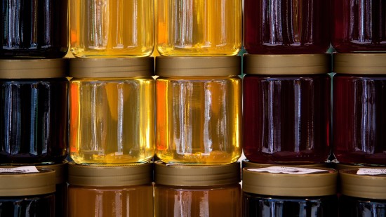 The Serai Kabini - glass jars containing various types of honey