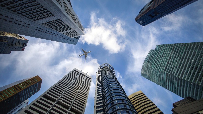 Lower view of skycrappers with blue sky in the background