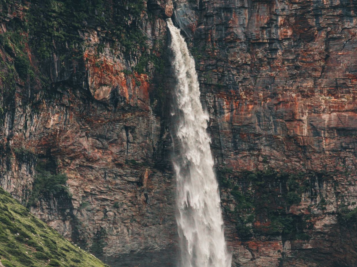 Image of a waterfall surrounded by trees