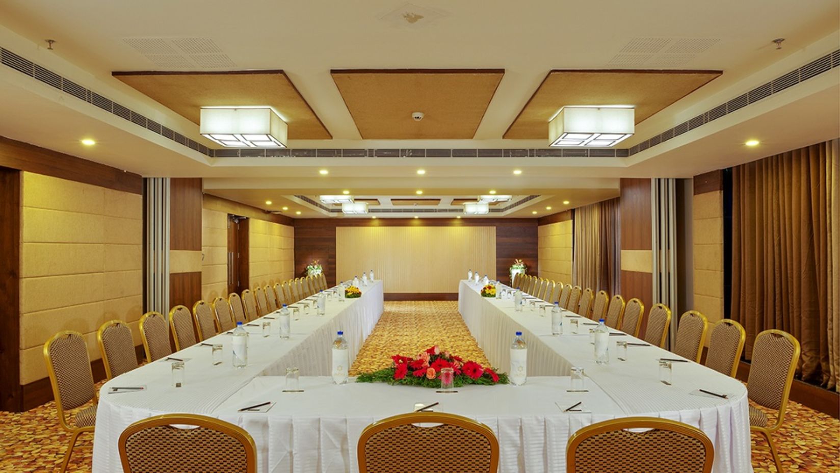 Dimora Thiruvananthapuram - image of Ruby 1 conference hall featuring brown and beige interiors and a U-shaped seating arrangement