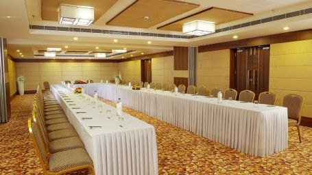 Dimora Thiruvananthapuram - image of Ruby 2 conference hall featuring brown and beige interiors and and multiple seating options