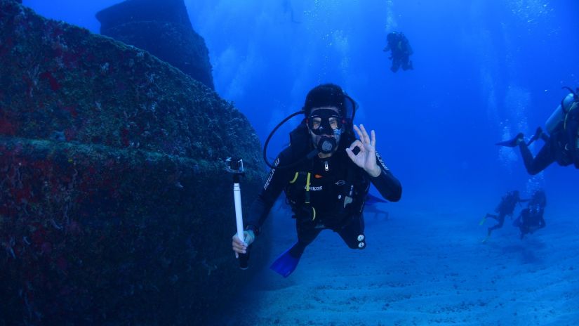 a person scuba diving underwater 1