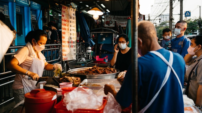 people at a street food stall