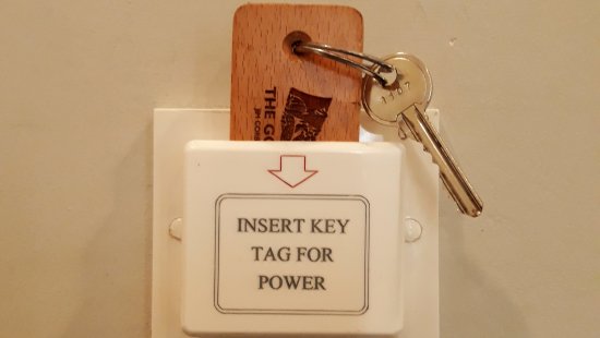 A wooden key tag used at Golden Tusk