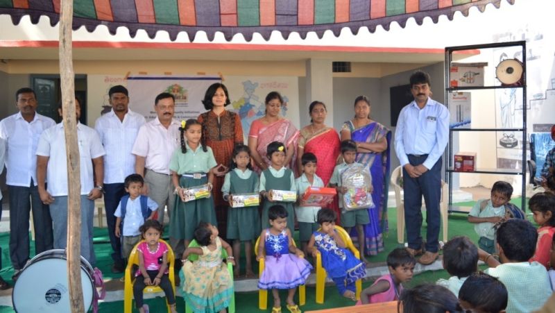 children and adults on a dais