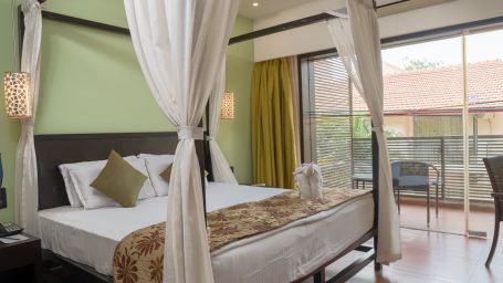 View of a king size bed in the Superior room at Kyriad Prestige Calangute, Goa