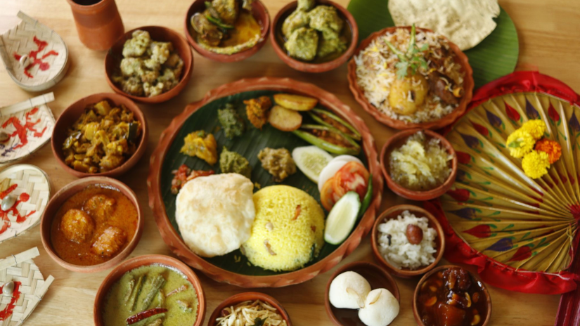 A table set with different items for Durga Puja feast 