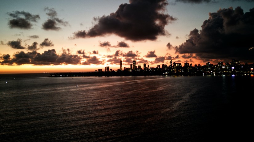 sunset at Juhu Beach with wet sand and colourful sky