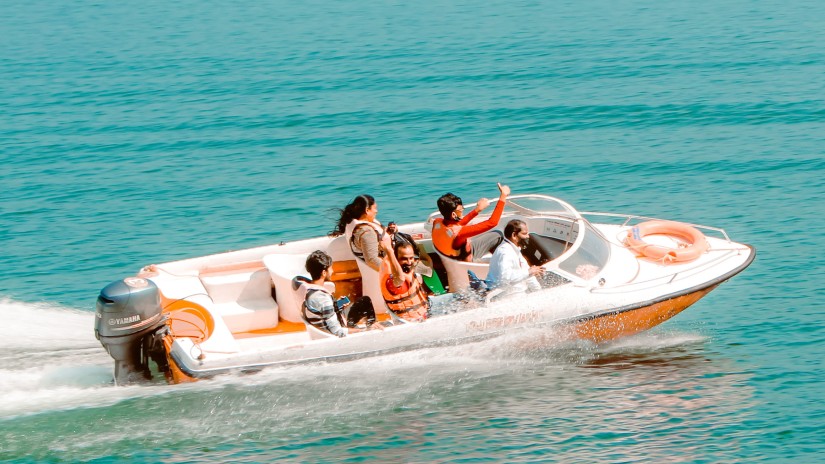 a family in a speed boat