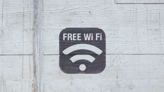 a logo of wifi with the words free wifi written above it 