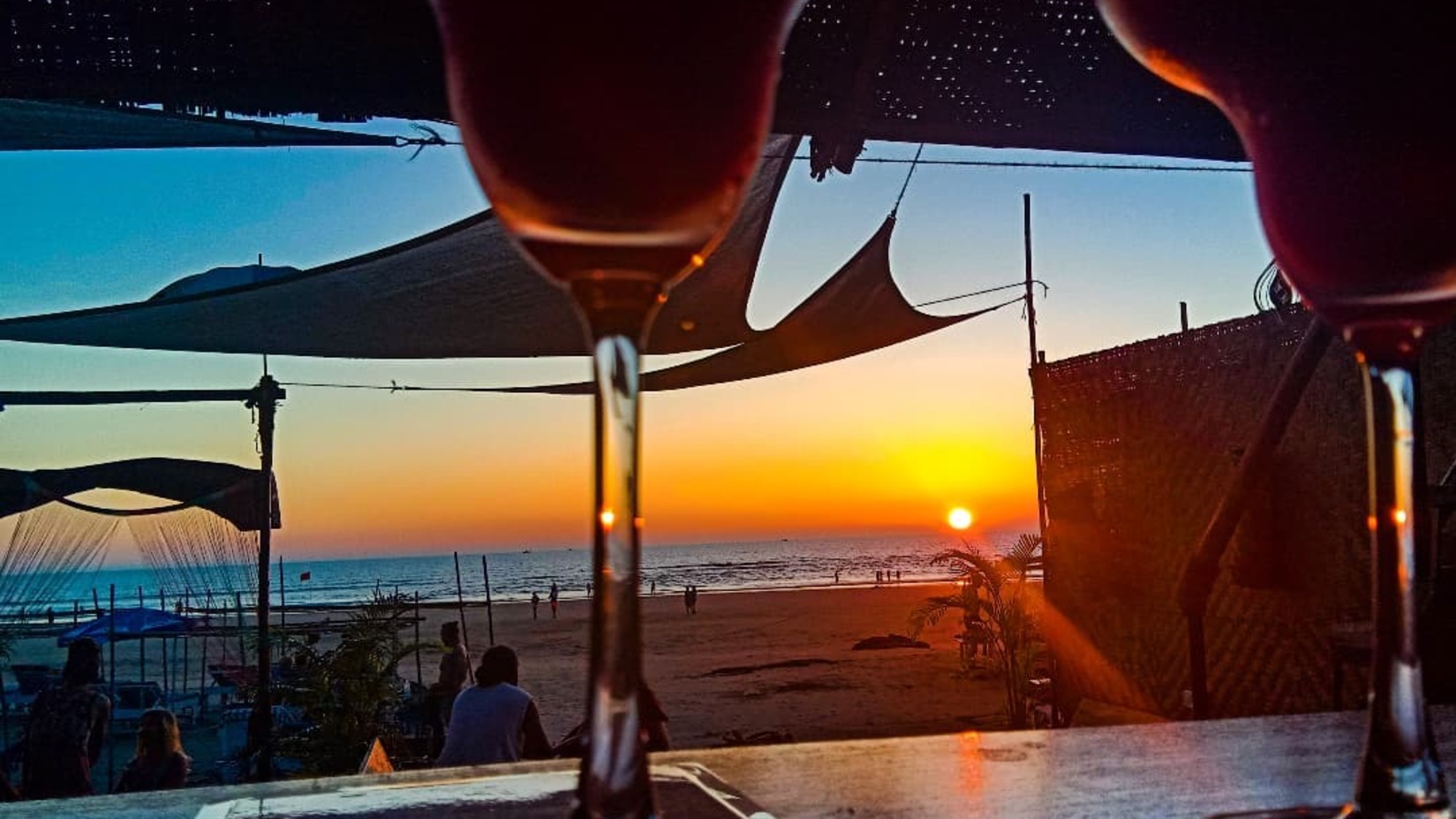 Drinks kept on the bar at the beach during sunset